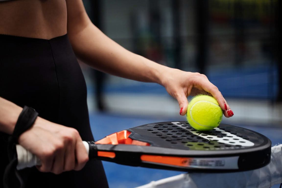 side view woman holding padel racket (1152x768)